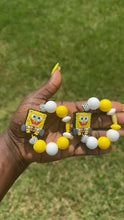 Load and play video in Gallery viewer, Yellow SB Pants Stanley Tumbler Handle Charm
